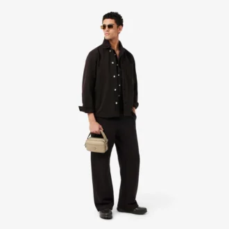 Bolso vertical de cuero con monograma