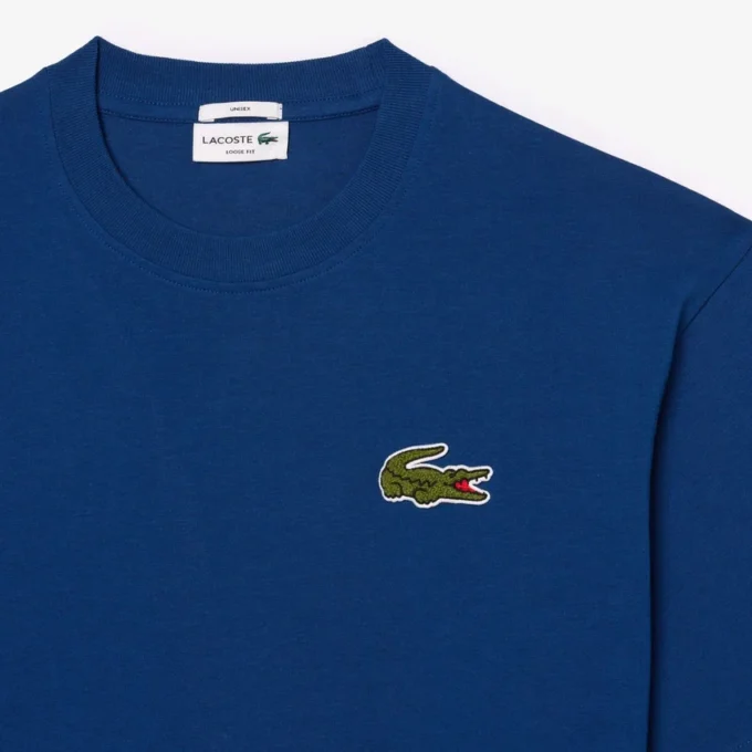 Camiseta unisex de corte holgado en algodón grueso con insignia