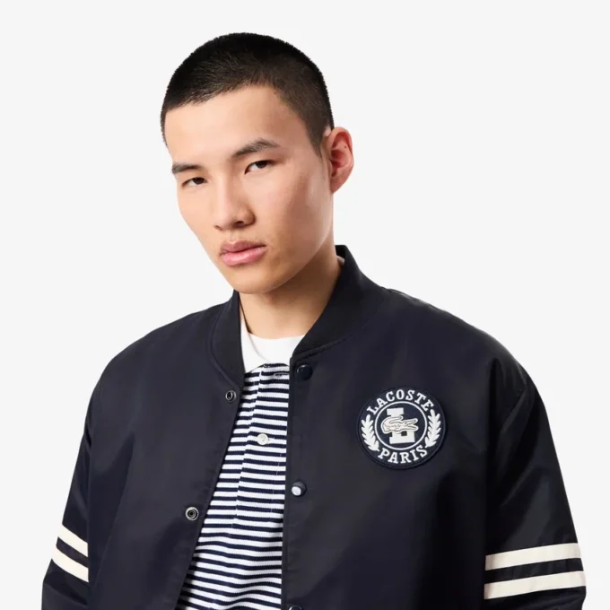 Chaqueta bomber repelente al agua con insignia bordada para hombre