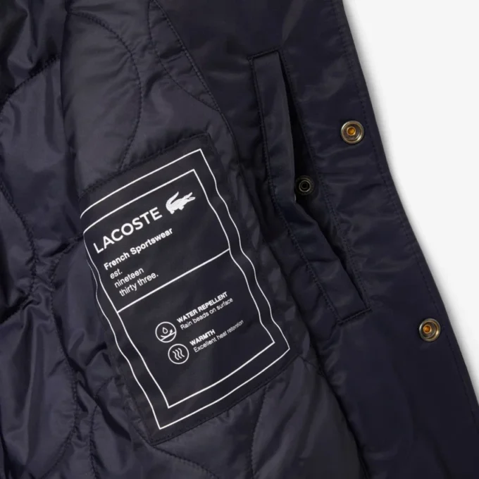 Chaqueta bomber repelente al agua con insignia bordada para hombre