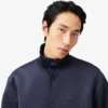 Chaqueta con cuello alto y bordado característico