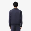 Chaqueta con cuello alto y bordado característico