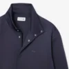 Chaqueta con cuello alto y bordado característico