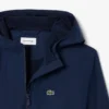 Cortavientos unisex con capucha
