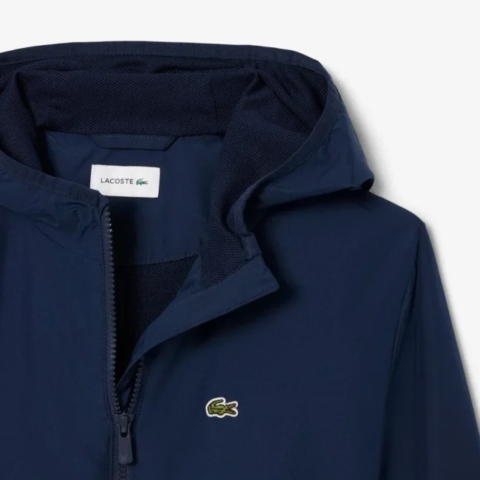 Cortavientos unisex con capucha