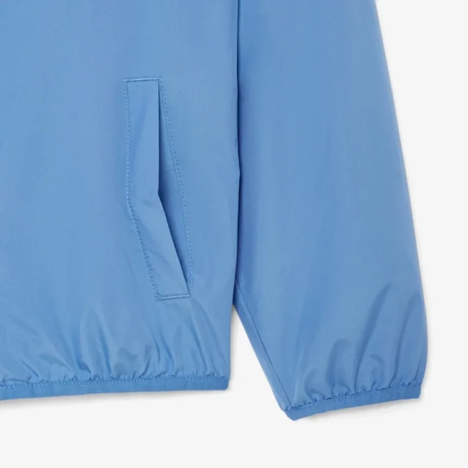 Cortavientos unisex con capucha