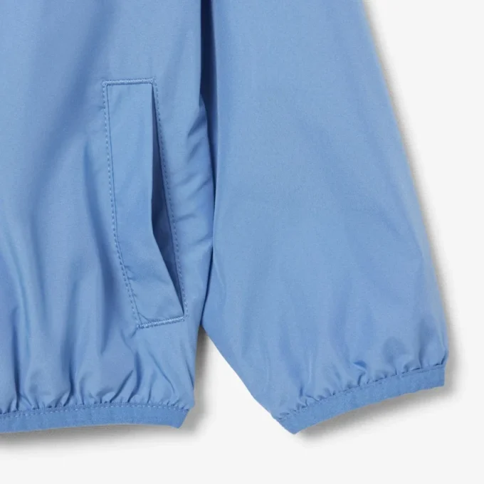 Cortavientos unisex con capucha