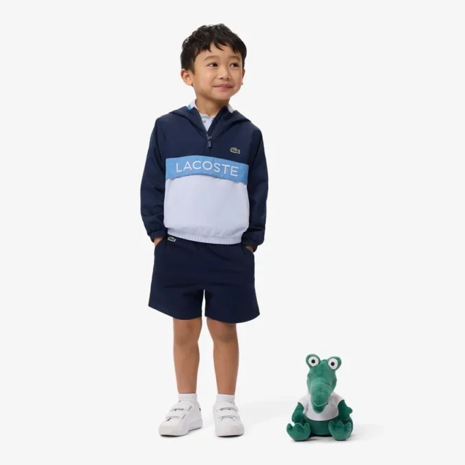 Cortavientos unisex con capucha