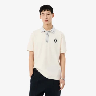Fabricado en Francia. Polo clásico con insignia