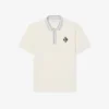 Fabricado en Francia. Polo clásico con insignia