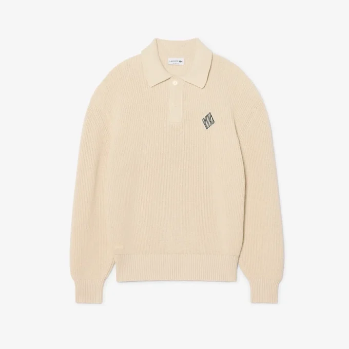 Jersey con cuello polo de canalé perlado y detalle de insignia