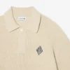 Jersey con cuello polo de canalé perlado y detalle de insignia