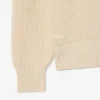 Jersey con cuello polo de canalé perlado y detalle de insignia