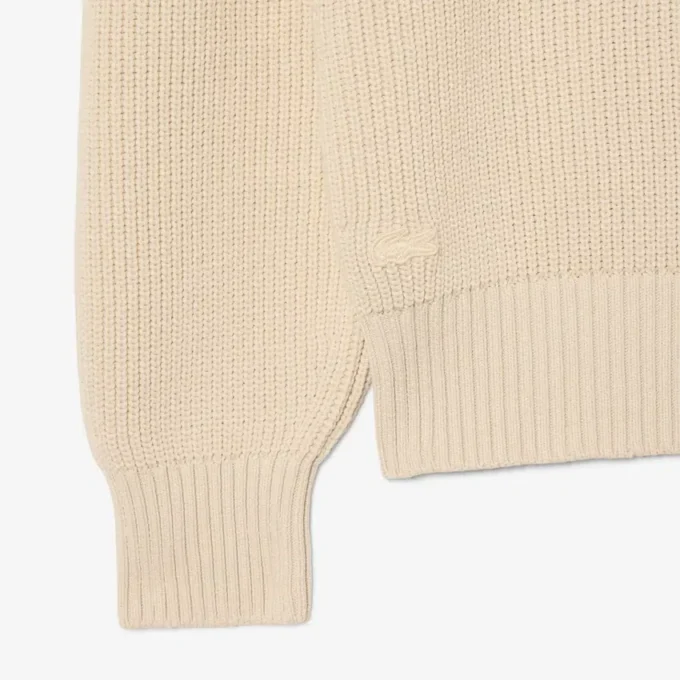 Jersey con cuello polo de canalé perlado y detalle de insignia