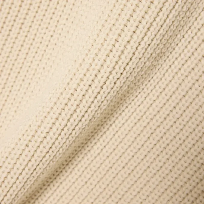 Jersey con cuello polo de canalé perlado y detalle de insignia