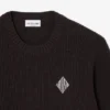 Jersey con detalle de insignia de punto acanalado perlado