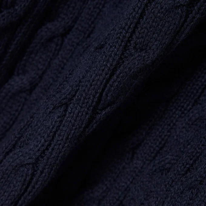 Jersey de cuello polo con tejido de punto trenzado a rayas