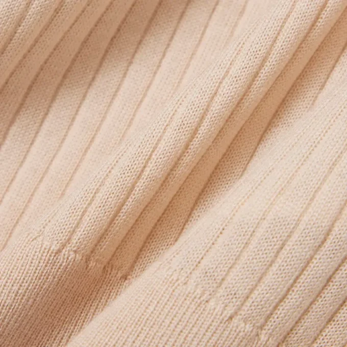 Jersey de lana merina con cuello polo y punto elástico 3D