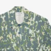 Jersey de manga corta con cuello polo y estampado gráfico para hombre