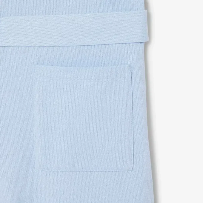 Mono con cuello polo de piqué elástico
