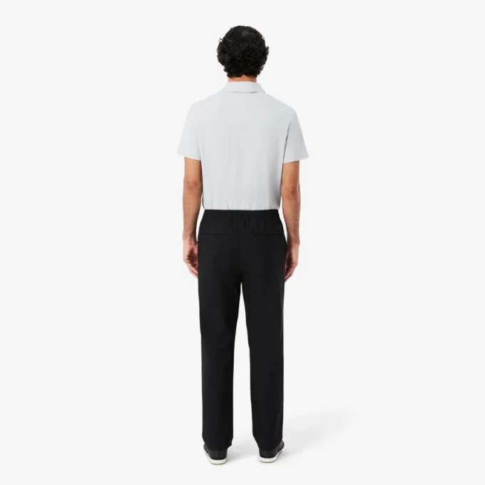 Pantalones chinos elásticos de corte regular