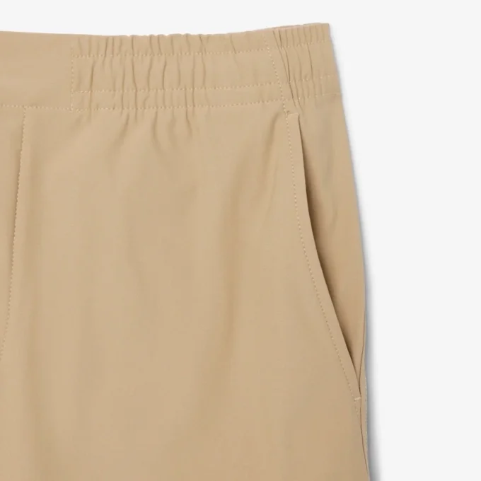 Pantalones chinos elásticos de corte regular