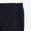 Pantalones chinos elásticos de corte regular