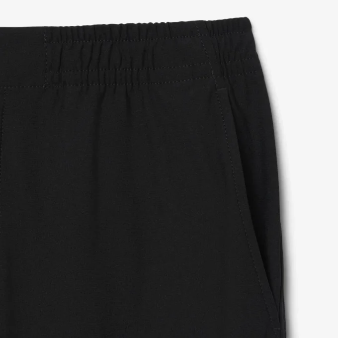 Pantalones chinos elásticos de corte regular