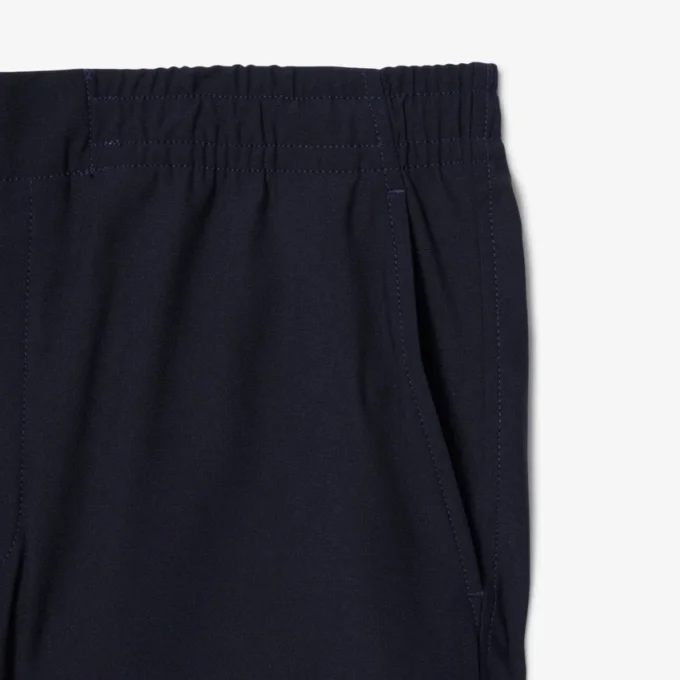 Pantalones chinos elásticos de corte regular