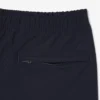 Pantalones chinos elásticos de corte regular