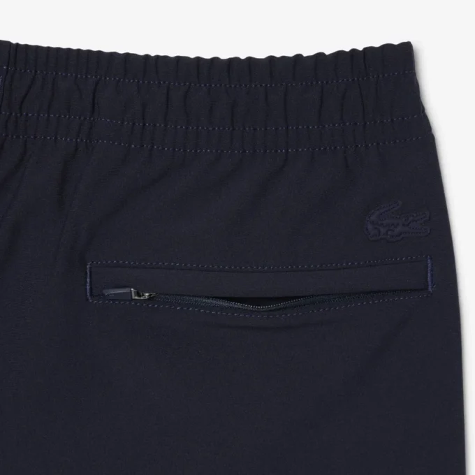 Pantalones chinos elásticos de corte regular