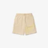 Pantalones cortos oversize de felpa de algodón orgánico con estampado de cocodrilo para hombre