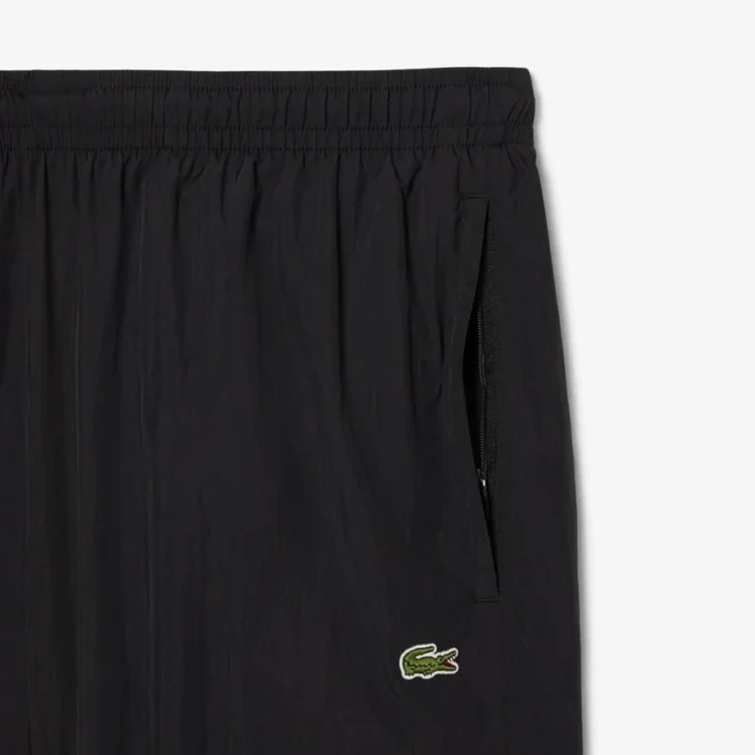 Pantalones de chándal ligeros y repelentes al agua para hombre