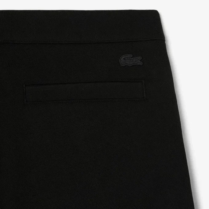 Pantalones de piqué con pliegues de corte holgado para hombre