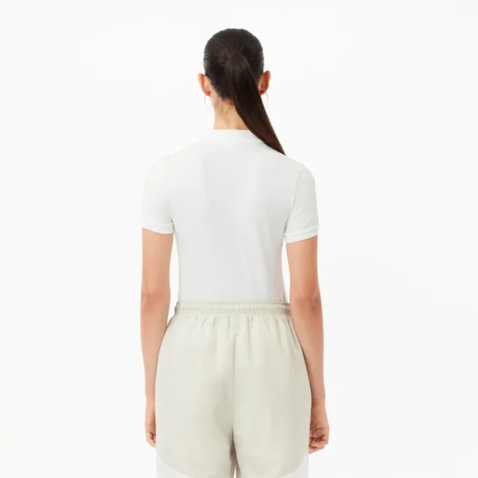 Polo de algodón elástico L.12.12 de corte entallado para mujer