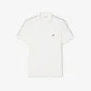 Polo de corte regular con rayas y logotipo