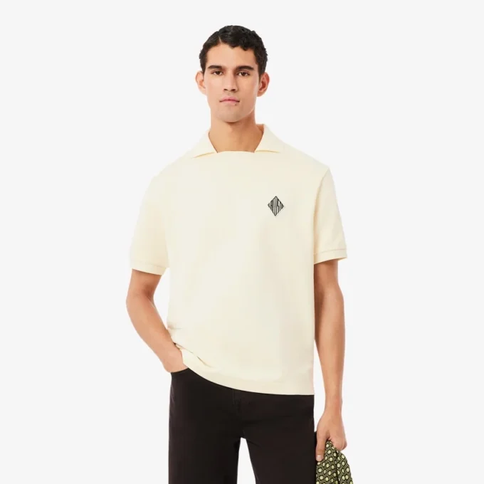 Polo de felpa de corte holgado con detalle de insignia
