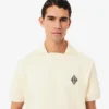 Polo de felpa de corte holgado con detalle de insignia
