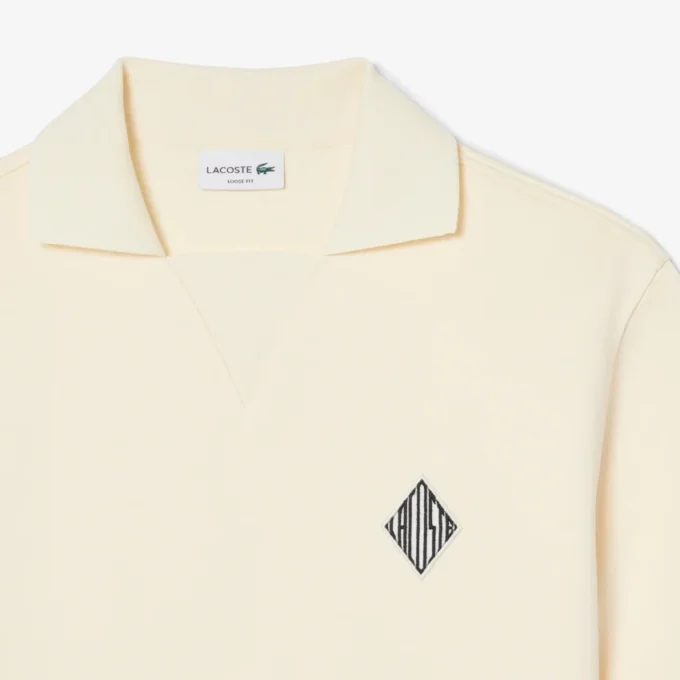 Polo de felpa de corte holgado con detalle de insignia