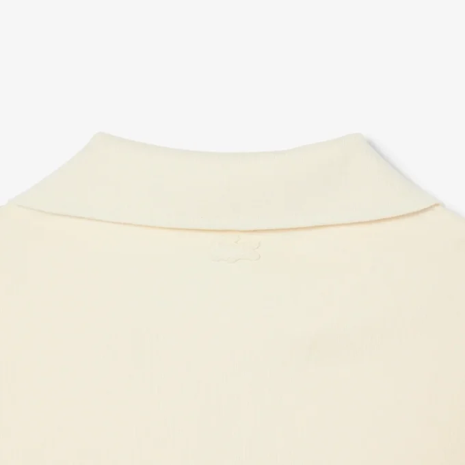 Polo de felpa de corte holgado con detalle de insignia