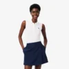 Polo de golf elástico con protección UV y corte entallado para mujer