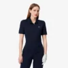Polo de golf elástico con protección UV y corte entallado para mujer