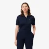 Polo de golf elástico con protección UV y corte entallado para mujer