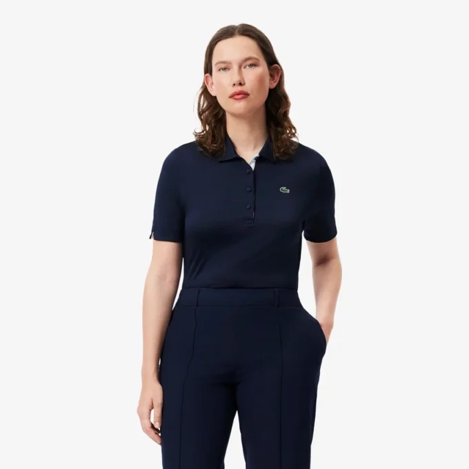 Polo de golf elástico con protección UV y corte entallado para mujer