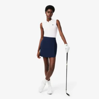 Polo de golf elástico con protección UV y corte entallado para mujer