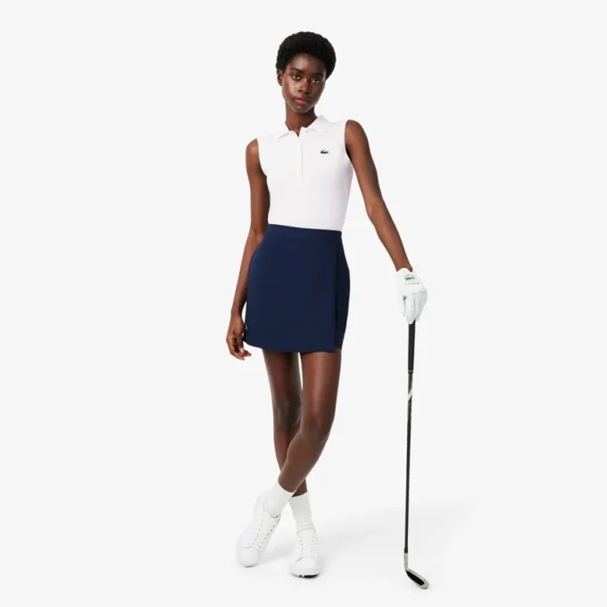 Polo de golf elástico con protección UV y corte entallado para mujer