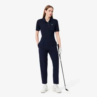 Polo de golf elástico con protección UV y corte entallado para mujer