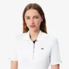 Polo de golf elástico con protección UV y corte entallado para mujer