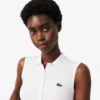 Polo de golf elástico con protección UV y corte entallado para mujer