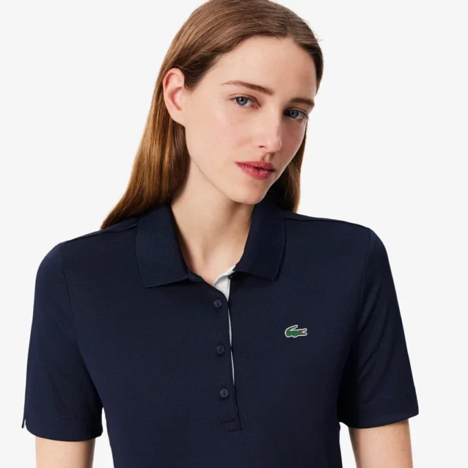 Polo de golf elástico con protección UV y corte entallado para mujer